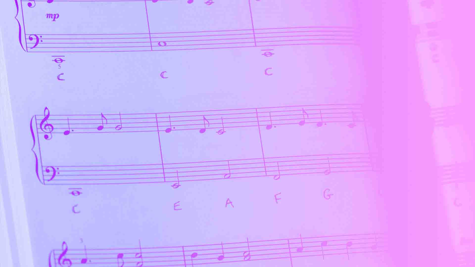 Sheet music with a pink hue