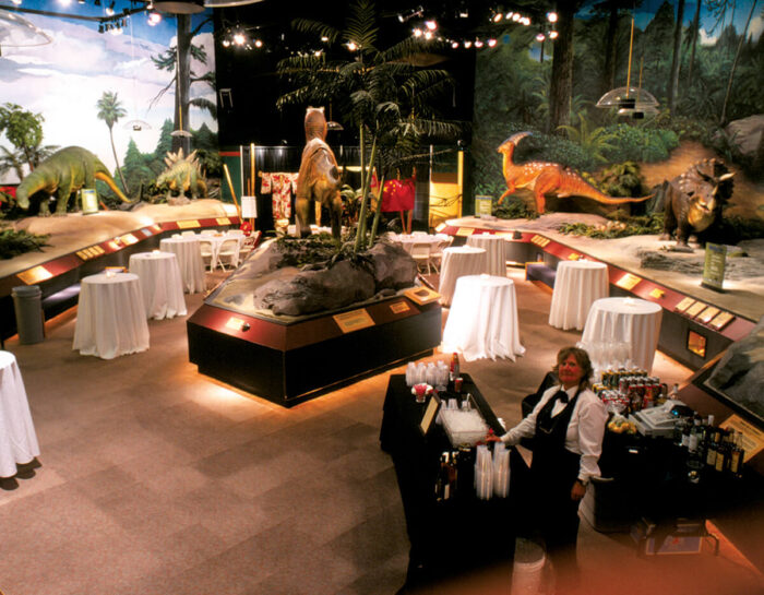Party table with animatronic dinosaurs