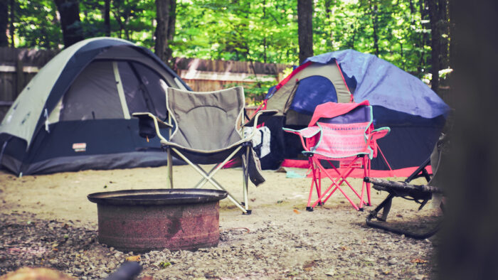 Campground with tents and chairs