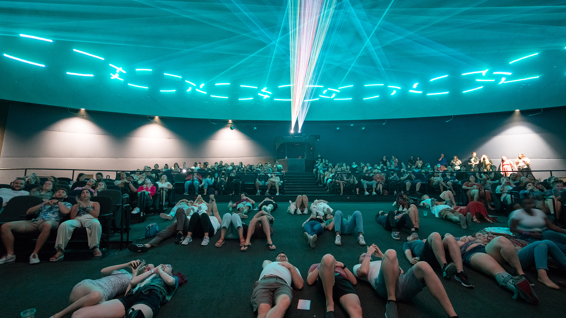 Happy hour attendees in the Laser Dome