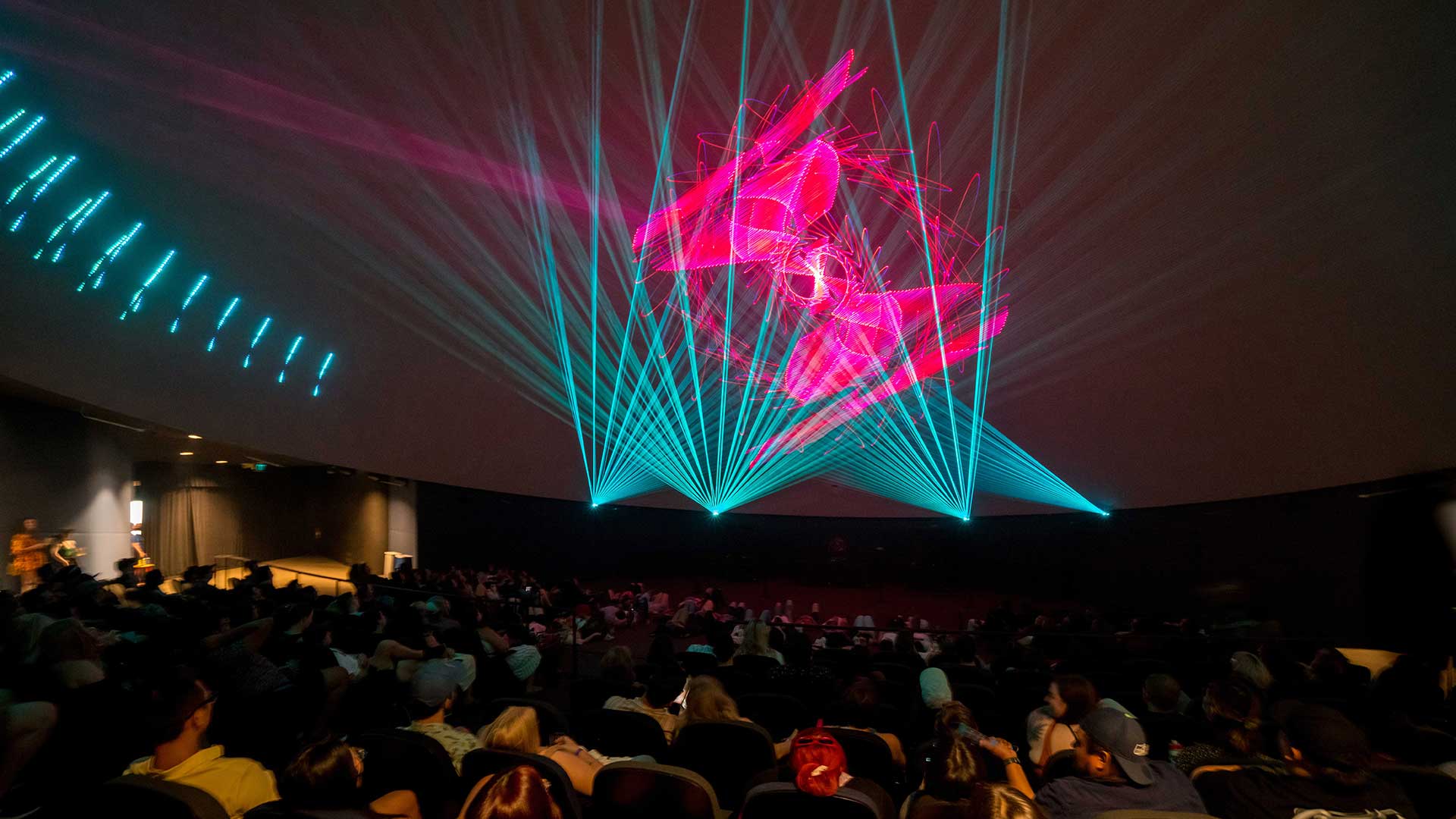 Audience attending Laser Dome shows during Happy Hour.
