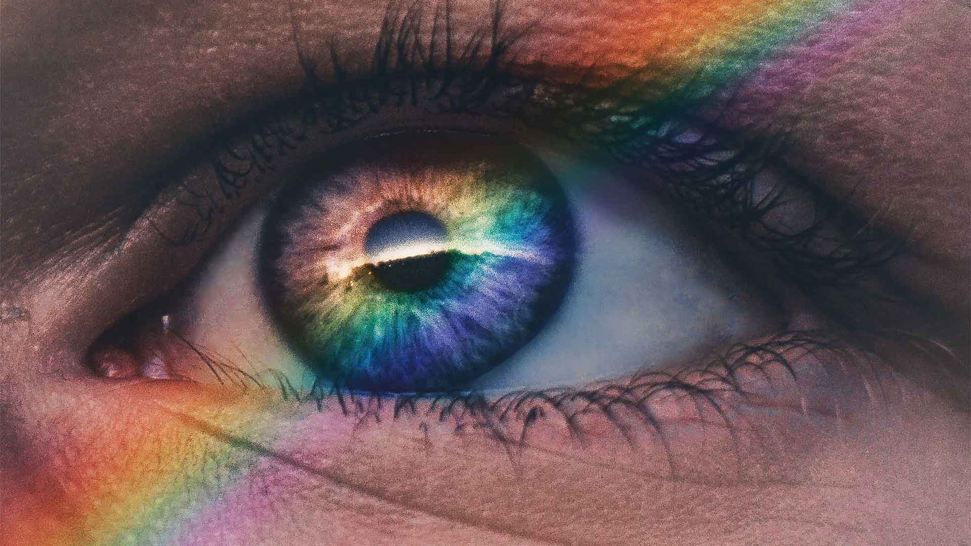 Blue eye cast in rainbow light