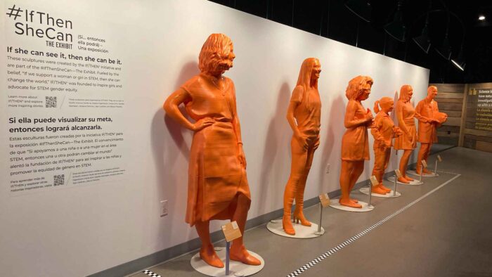 Six orange statues from the IfThenSheCan portion of the Science for Everyone exhibit
