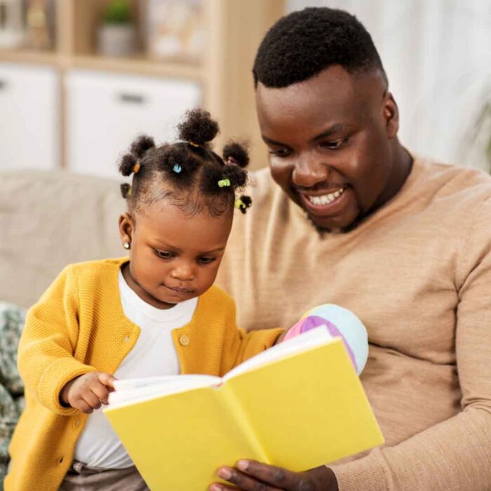 A dad reading to his child