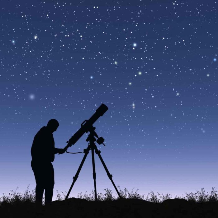 Man using a telescope to stargaze
