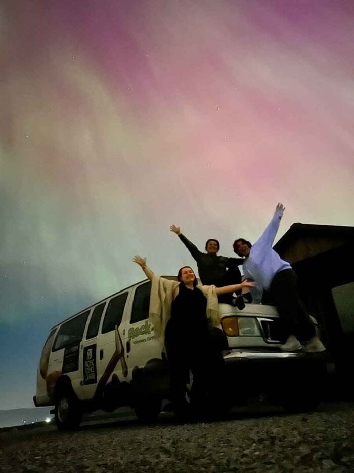 Science on Wheels team with aurora borealis