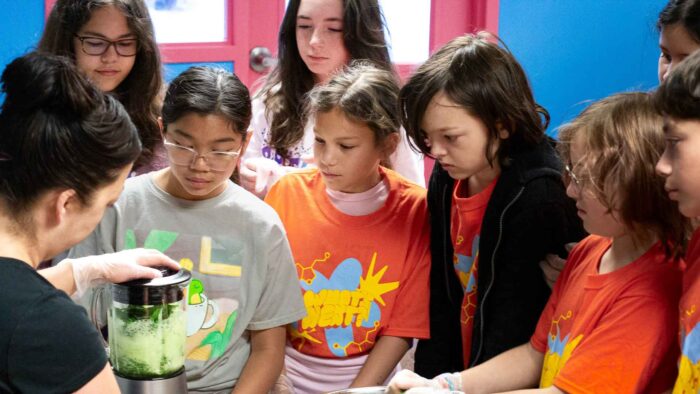 Adrienne Chamberlain using a blender with campers