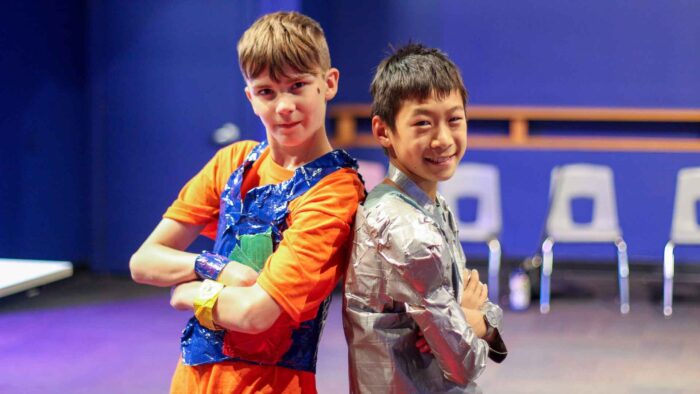 Two campers pose in during their duct tape fashion show