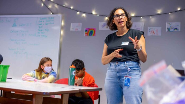 Daniella Cohen speaking to campers