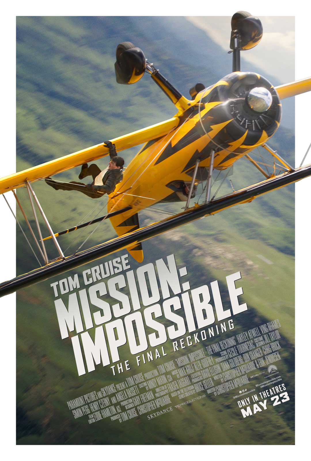 Tom Cruise on a yellow helicopter for the poster for Mission: Impossible - The Final Reckoning